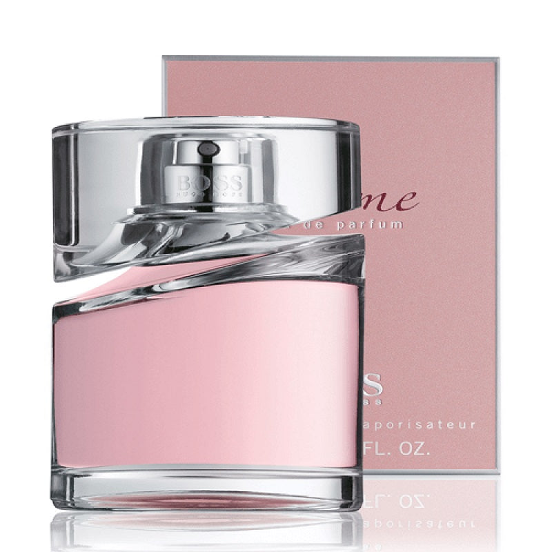 Pink perfume bottle with silver cap on a white background
