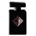 A black bottle of Mystic Experience Eau de Parfum by Initio Parfums Prives with a red and white floral design on the label.