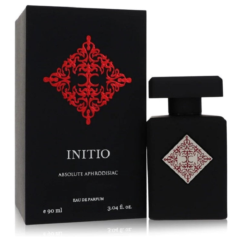 Black perfume bottle and packaging with red and white design, labeled 'Initio Absolute Aphrodisiac'.