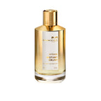 Perfume bottle with gold cap and label on a white background
