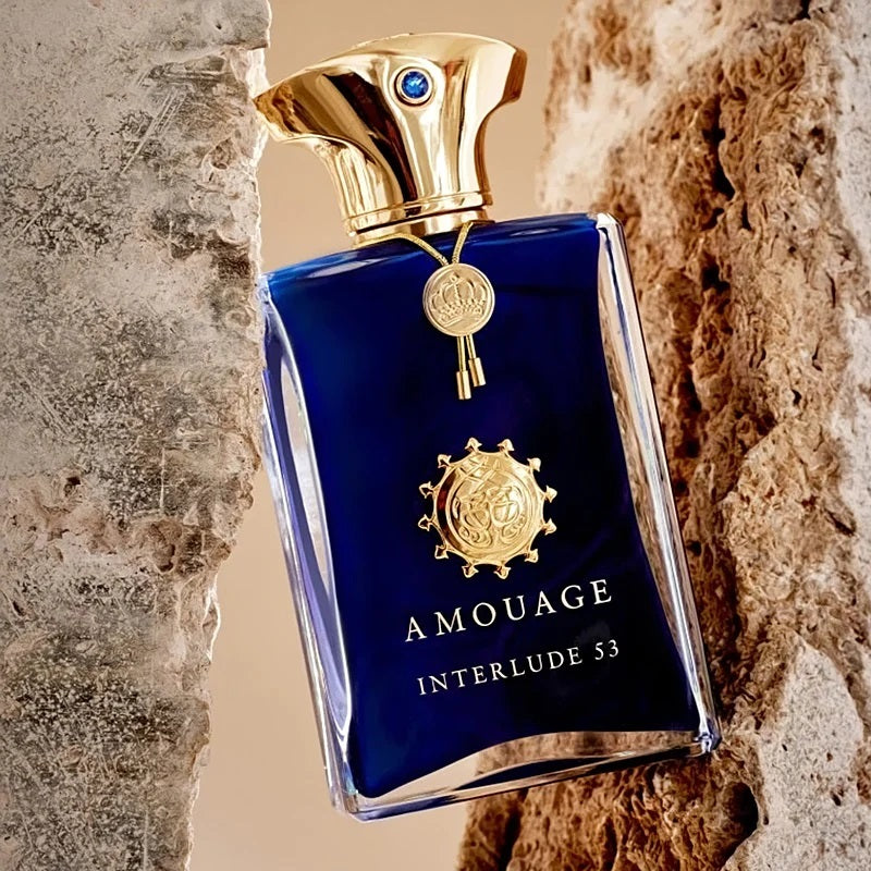 Amouage Interlude 53 perfume bottle against a textured stone wall background