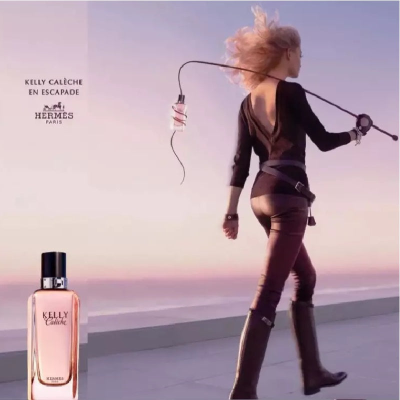 Woman running with a perfume bottle against a sunset background