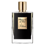 Perfume bottle with gold cap and label on a white background