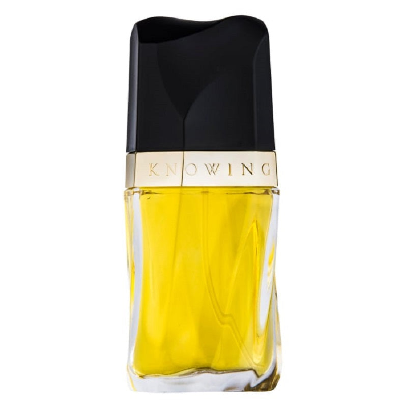 Perfume bottle with black cap and yellow body on a white background