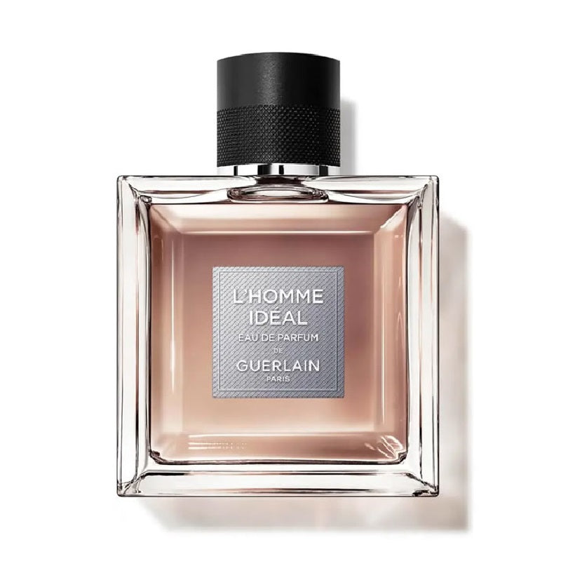 A square-shaped glass bottle of Guerlain L'Homme Ideal Eau de Parfum with a black cap and a label displaying the product name and brand.