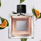 Perfume bottle with orange slices and leaves on a white background