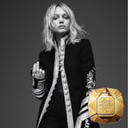 Black and white portrait of a person in formal attire with a gold 'Perfume Lady Million' bottle.