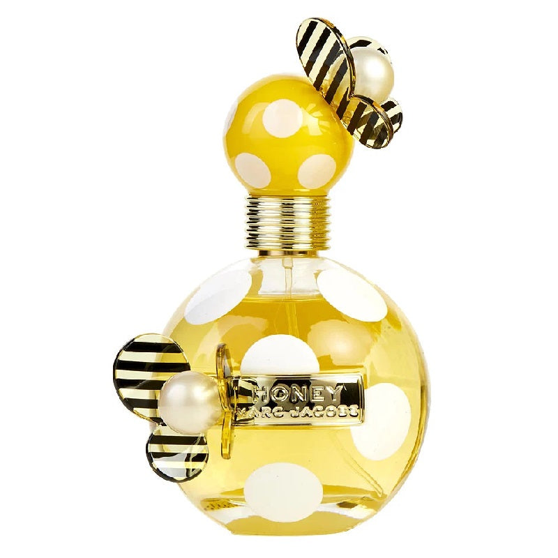 Yellow perfume bottle with polka dots and bee design on a white background