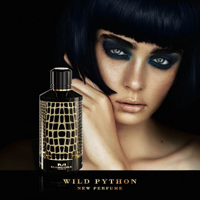 Perfume bottle labeled 'Wild Python' with a model in the background