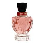 Pink perfume bottle with black cap on a white background