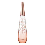 A spray bottle of 'Pure Petale De Nectar' Eau de Toilette by Issey Miyake, featuring a clear glass construction with rose gold accents and rose petal designs.