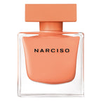Narciso perfume bottle with peach-colored cap and body on a white background