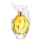 A bottle of L'Air Du Temps Eau de Toilette by Nina Ricci with a clear, golden yellow liquid visible and a white floral decoration on the top.