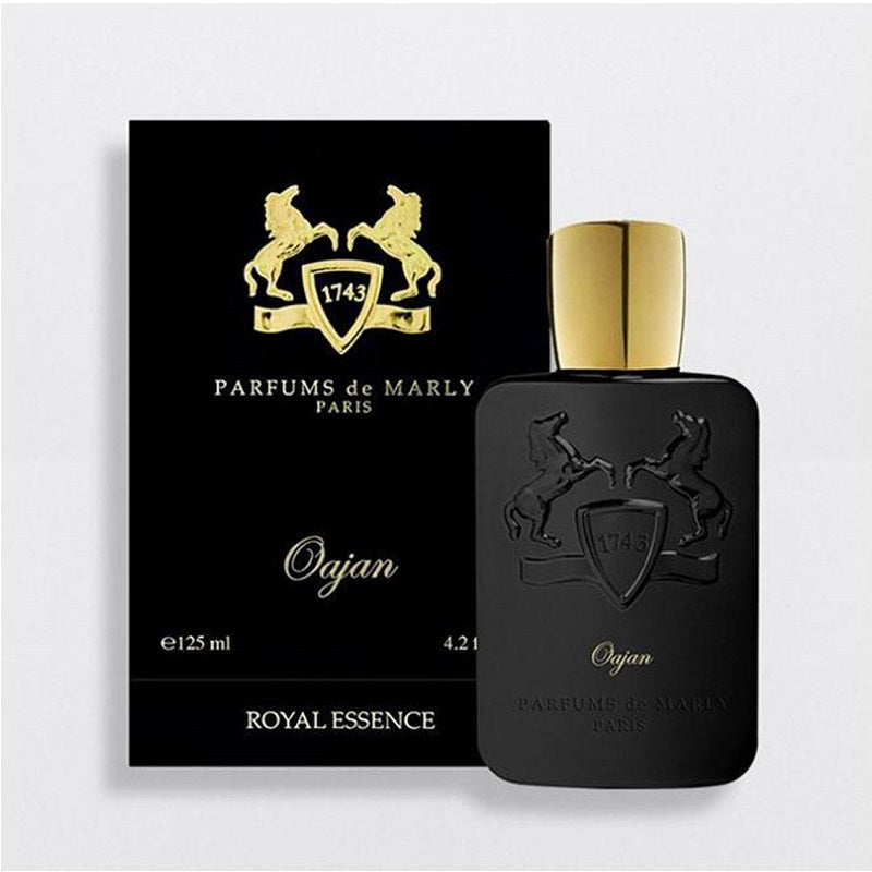 Box and Bottle Image, Oajan 125 ml Eau de Parfum by Parfums de Marly – elegant bronze-toned bottle and matching box reflecting opulence, depth, and refined craftsmanship.