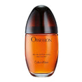 A bottle of Calvin Klein's Obsession Eau de Parfum with a clear, amber-colored liquid visible and the label on the front.