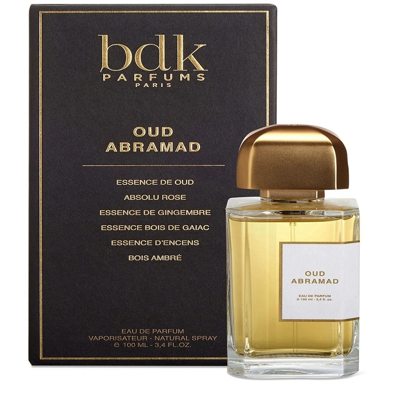 A bottle of 100ml Oud Abramad Eau De Parfum by BDK Parfums next to its packaging box.