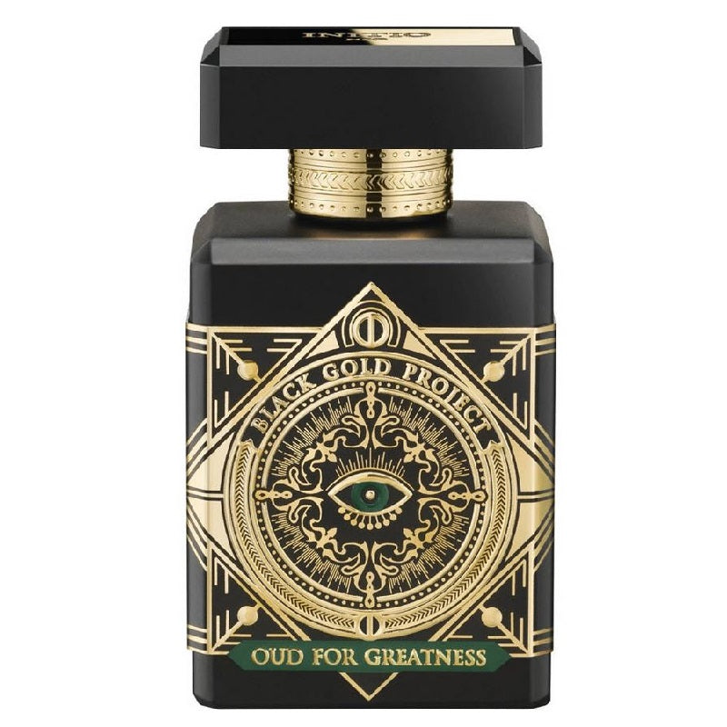 A black perfume bottle with gold details, including an eye symbol and text that reads '100 Gold Fragrances OUD FOR GREATNESS'. The cap is gold-colored with intricate black detailing.