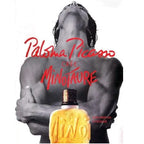 Paloma Picasso Minotaure perfume with a shirtless man holding a yellow perfume bottle.