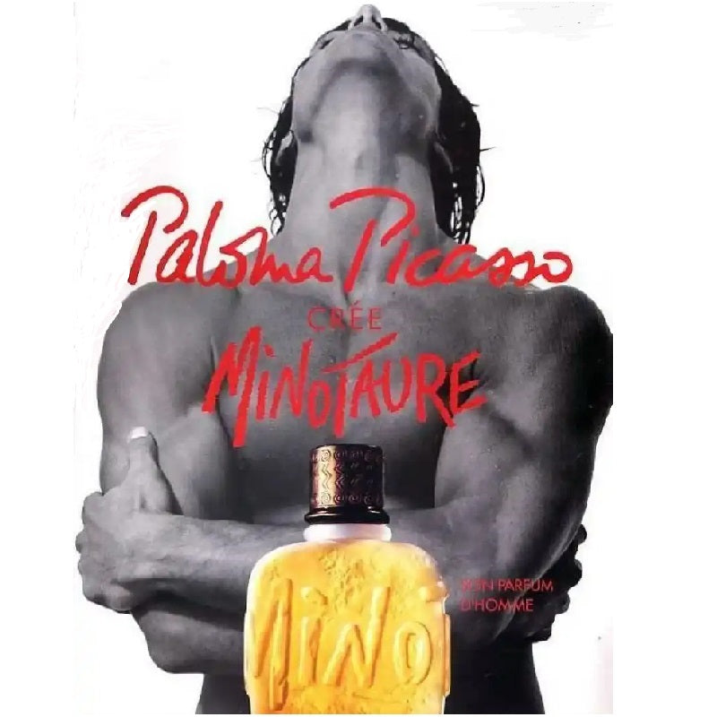 Advertisement for Paloma Picasso Minotaure perfume with a shirtless man holding a yellow perfume bottle.