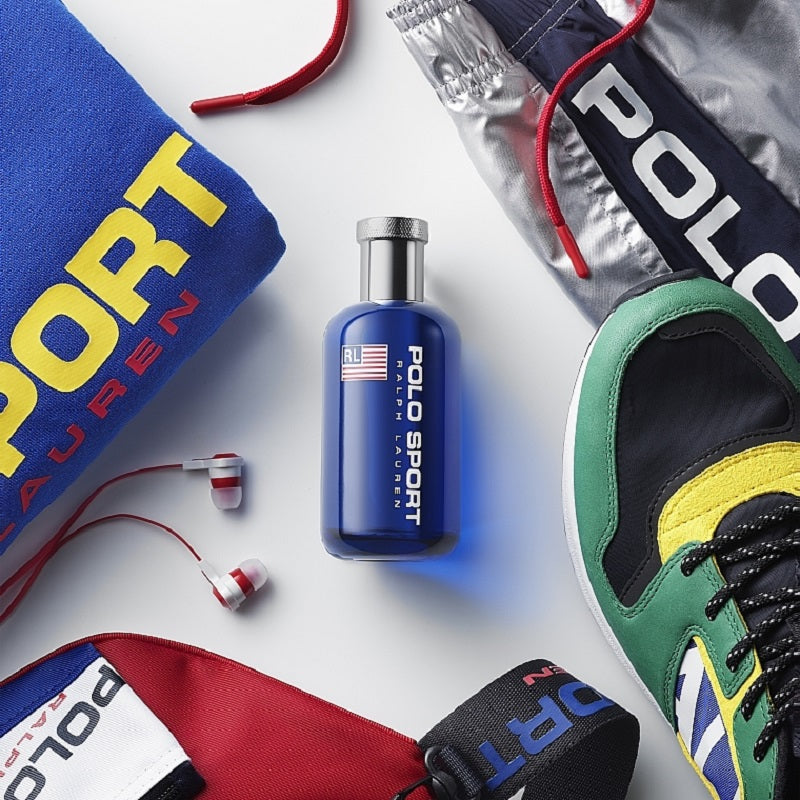 Polo Sport Ralph Lauren cologne bottle with accessories on a white background