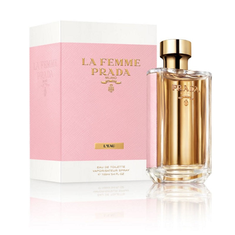 Prada La Femme L'Eau perfume bottle and packaging on a white background