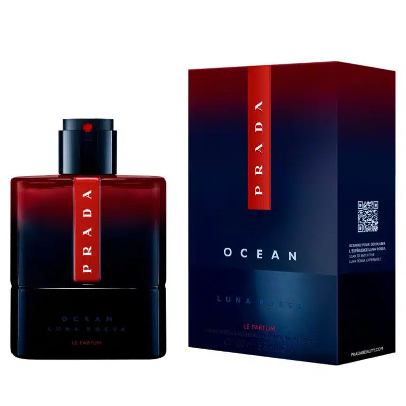 Prada Ocean Luna Rossa Le Parfum bottle next to its retail box, featuring a dark blue to red gradient design with a vertical red Prada logo band.
