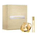 Rabanne Lady Million perfume set with textured box, diamond-shaped bottle, and smaller cylindrical container on a white background.