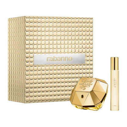 Rabanne Lady Million perfume set with textured box, diamond-shaped bottle, and smaller cylindrical container on a white background.