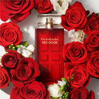 Elizabeth Arden Red Door perfume bottle surrounded by red and white roses