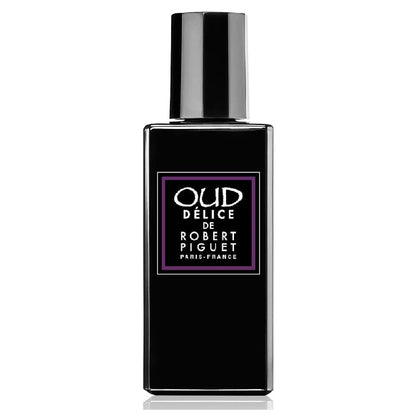 Black perfume bottle with 'Oud Delice de Robert Piguet' label on a white background