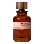 Brown perfume bottle with a label on a white background