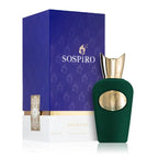 Sospiro Pasticcio Eau de Parfum bottle in dark green velvet with a gold cap, displayed next to its blue and white packaging box on a white background.