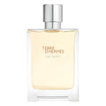 A glass bottle of Terre d'Hermes Eau Givree Eau de Parfum by Hermès with a white cap and yellow-tinted liquid inside.