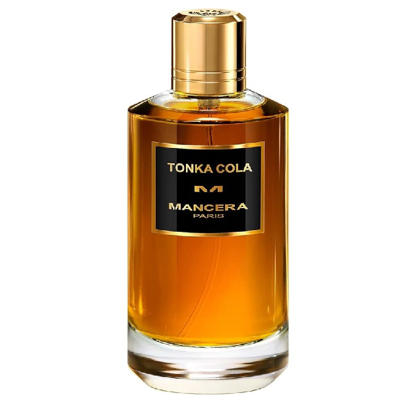 A glass bottle of Tonka Cola Eau de Parfum by Mancera with a gold-colored cap and a dark amber liquid visible.