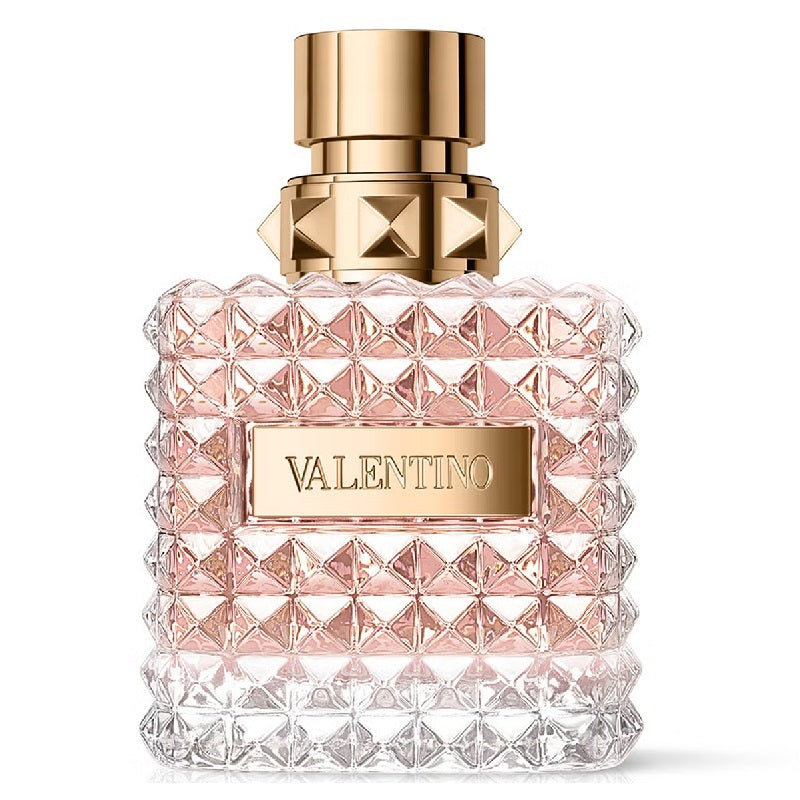 Valentino perfume bottle with geometric design and gold cap on a white background