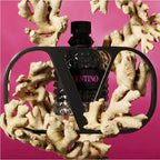 Valentino perfume bottle on a coral-like structure with a pink background