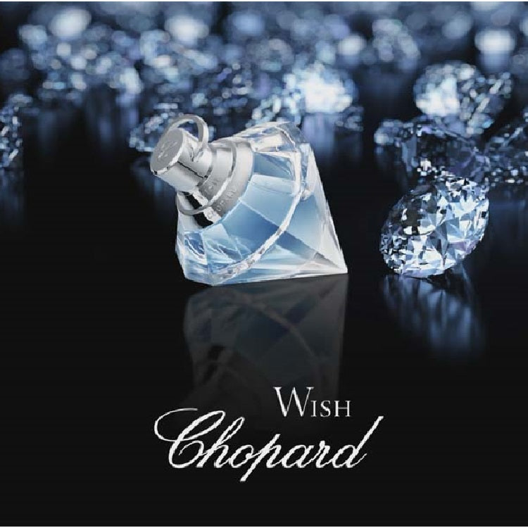 Chopard Wish diamond-shaped perfume bottle with diamonds on a dark background