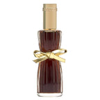 Perfume bottle with gold cap and bow on a white background