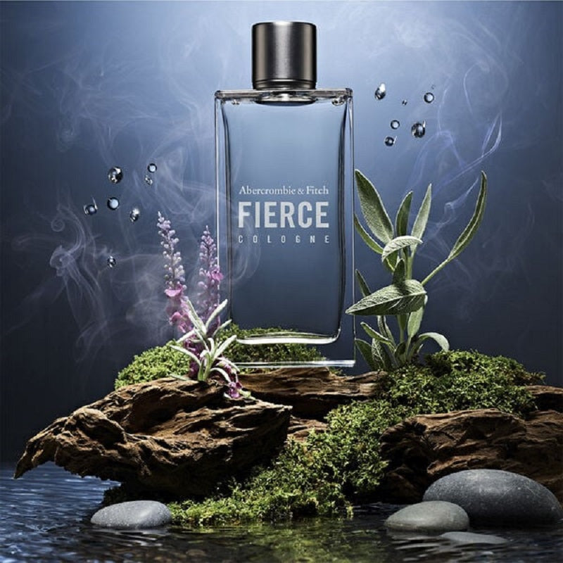 Abercrombie & Fitch 100ml Fierce cologne bottle on a natural background with plants and water.