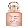 Abercrombie & Fitch Away Tonight perfume bottle in a soft peach-pink glass with a metallic rose gold cap and handle, shown on a plain white background.