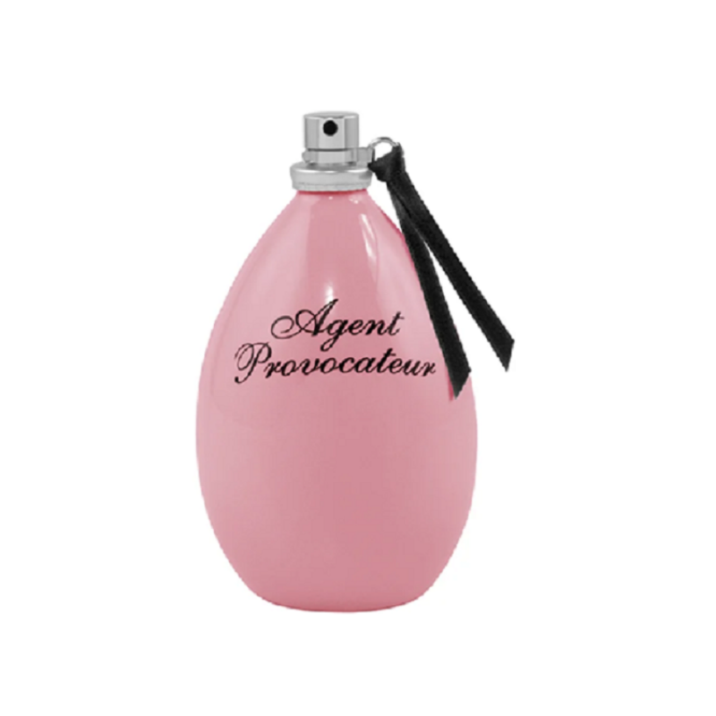 A pink bottle of Agent Provocateur Eau de Parfum with a black cap and ribbon, labeled with the brand name.