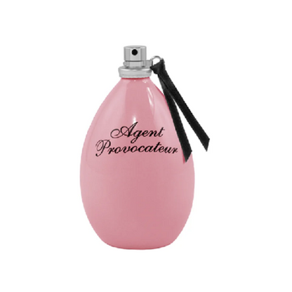 A pink bottle of Agent Provocateur Eau de Parfum with a black cap and ribbon, labeled with the brand name.