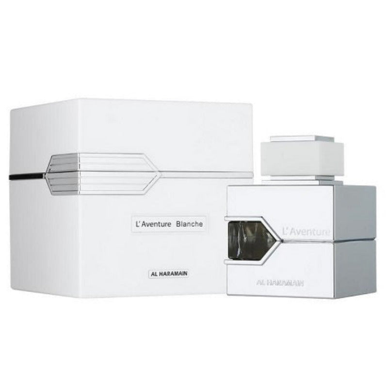 A bottle of L'Aventure Blanche eau de parfum by Al Haramain alongside its white packaging box.