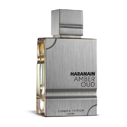 A bottle of Al Haramain Amber Oud Carbon Edition Eau de Parfum with a clear, sleek design and a silver cap.