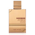A bottle of Amber Oud Ruby Edition Eau de Parfum by Al Haramain with a gold and brown color scheme.