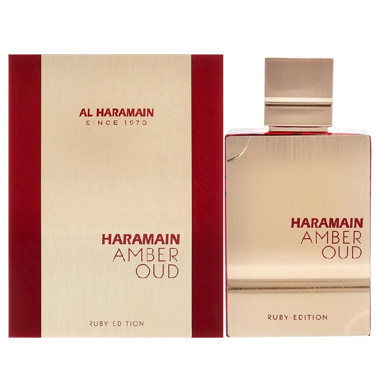 A product image featuring Al Haramain Amber Oud Ruby Edition Eau de Parfum in a clear glass bottle with a gold label, alongside its red and gold packaging box.