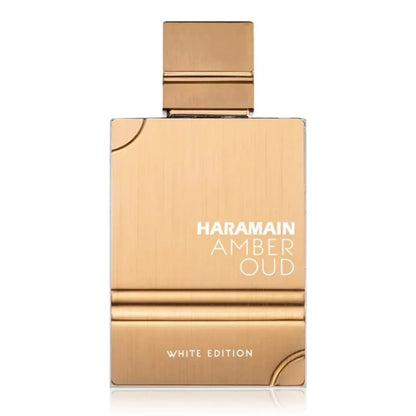 A bottle of Amber Oud White Edition eau de parfum by Al Haramain with a gold and white label on a white background.