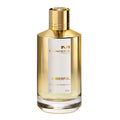 A bottle of Amberful Eau de Parfum by Mancera with a clear, golden liquid visible and a gold-colored cap. The label displays the product name and brand.
