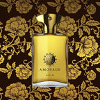 Amouage Gold perfume bottle on a floral patterned background