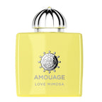 A yellow bottle of Love Mimosa Eau de Parfum by Amouage with a decorative cap and branding on the bottle.